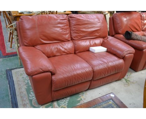 An electric reclining two seat sofa
