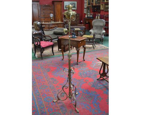 An arts and crafts brass oil standard lamp with twin Duplex burner
