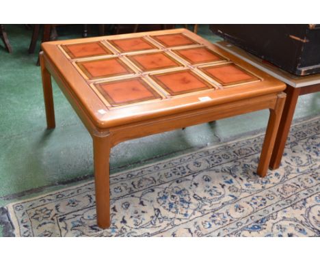 A Nathan coffee table, tile top, and another retro coffee table, with top decorated with poppies