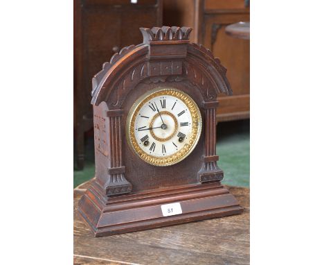 An American Ansonia Mantel clock, shaped arch top oak case, white and gilt dial, Roman numerals, 8 day movement c.1900