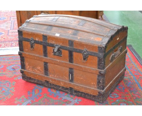 A Victorian domed top, metal bound travel trunk