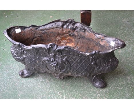 A Victorian Rococo style cast iron lozenge shaped planter, supported on four scroll feet, 50cm wide