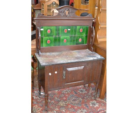 An Art Nouveau tile back washstand, rouge marble top, single door cupboard to base