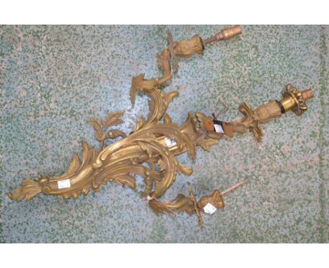 A gilt wall light with three branches 