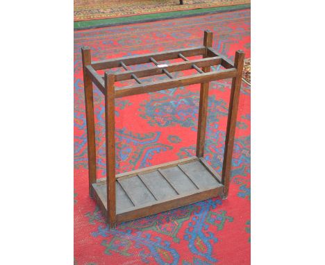 An oak rectangular stick stand with tray