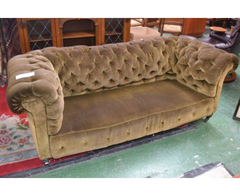 A Victorian green draylon chesterfield, deep button back settee