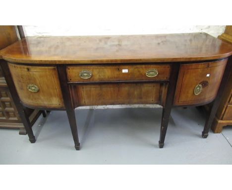 George III mahogany and line inlaid sideboard, the semi bow front top above two central drawers flanked by cellarette drawers