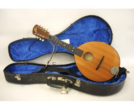 Flat iron mandolin, model 2M, serial number 86013265 with a mahogany neck, ebony finger board, spruce top and birdseye maple 