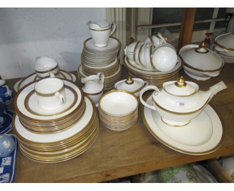 An extensive Royal Doulton ' Royal Gold ' dinner and tea service comprising:  ten 27cm plates, ten 22.5cm plates, ten 20cm pl