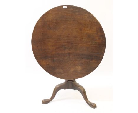 18th Century mahogany circular pedestal table, the one piece figured tilt top above a vase turned centre column and tripod ba