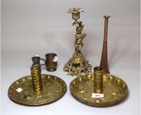 Near pair of Arts and Crafts repousse brass chamber candlesticks, 20cm diameter, together with a 19th Century ormolu candlest