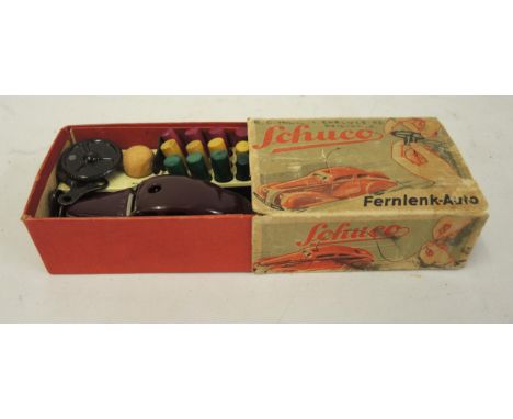 Schuco tin plate clockwork model car with spare keys, in original box 