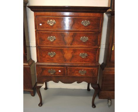 1920's Queen Anne style chest on stand, the moulded top above three long drawers with brass swan neck handles above a further