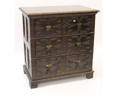 Late 17th  / 18th Century oak moulded front chest of three long drawers, raised on bracket feet with later carvings, handles 