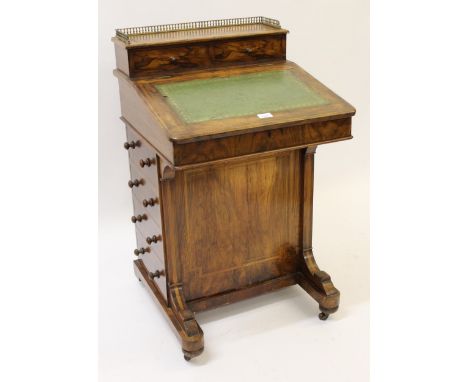 Victorian figured walnut Davenport desk, with brass galleried top over two drawers, the leather top over four side drawers, 5