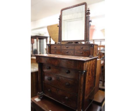 19th Century figured mahogany dressing chest, the superstructure with a rectangular swing frame mirror above six small drawer