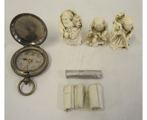 World War I brass military issue compass, together with a carrier pigeon message case and three composite netsuke 