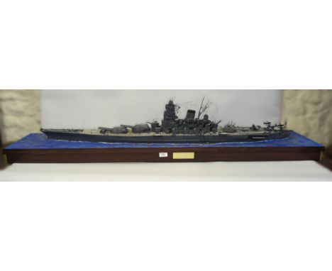 Built 1/350 scale model of IJN Yamato battleship on a plinth base, 154cm x 32cm 