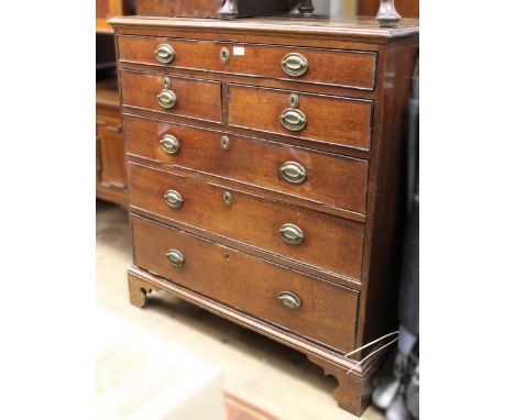 George III oak straight front chest of one long, two short and three further long graduated drawers with oval brass handles a