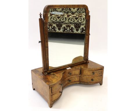 Antique Continental walnut box toilet mirror, the swing plate above six serpentine shaped drawers 