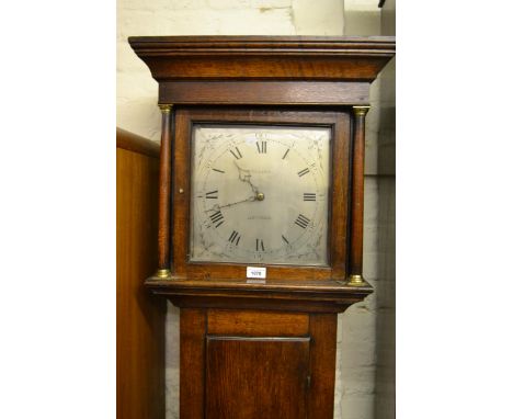 George III oak longcase clock, the square hood above a rectangular panel door and conforming plinth, the silvered dial with A