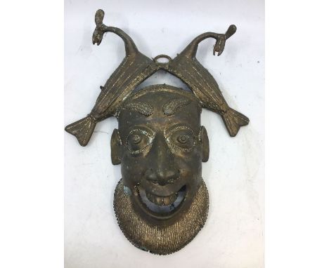 An Indian bronze wall hanging mask. H:26cm