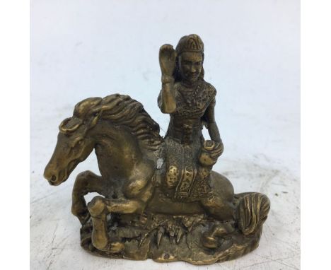 A small Indian bronze figure of a woman on a horse. H:5.8cm