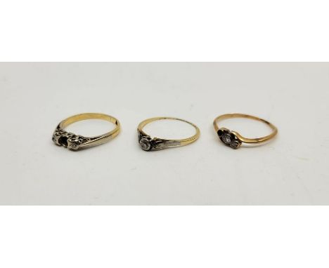 Three 18ct. gold and diamond set rings,&nbsp;to incldue a diamond solitaire ring and two three stone diamond rings (both lack