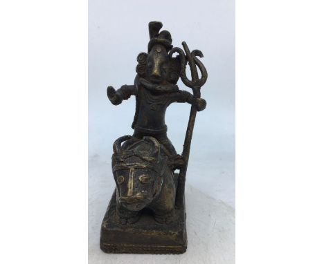 An Indian bronze figure of a deity. H:14.9cm