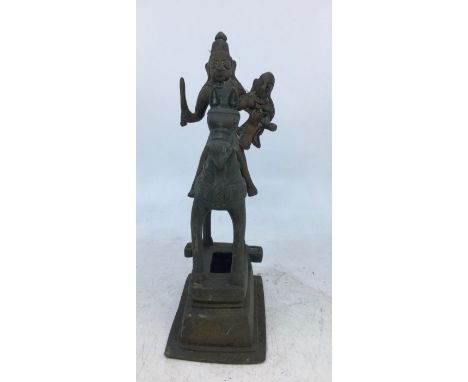 An Indian bronze figure of a man on a horse. H:21cm
