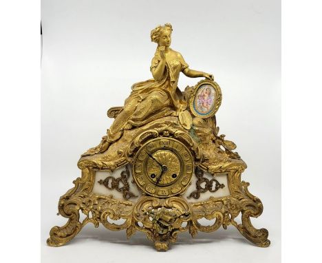 A late 19th century French ormolu figural mantel clock, bell strike, having Roman numeral chapter ring with alabaster panels 