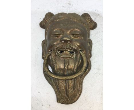 A Chinese bronze door knocker. H:17cm