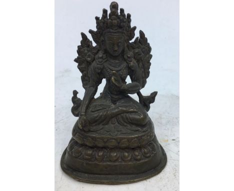 A small Sino-Tibetan bronze figure of a deity. H:7.6cm