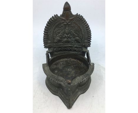 An Indian bronze lamp.&nbsp;