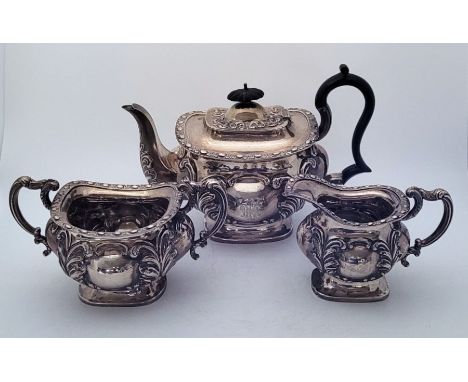 A silver three piece tea service, by S Glass, Birmingham 1904, the teapot with ebonised handle and lid finial. (gross weight 