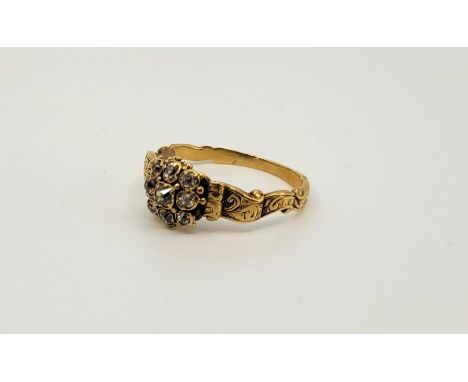 A 19th century precious yellow metal diamond cluster ring, set nine old-cut diamonds with engraved shoulders (yellow metal as