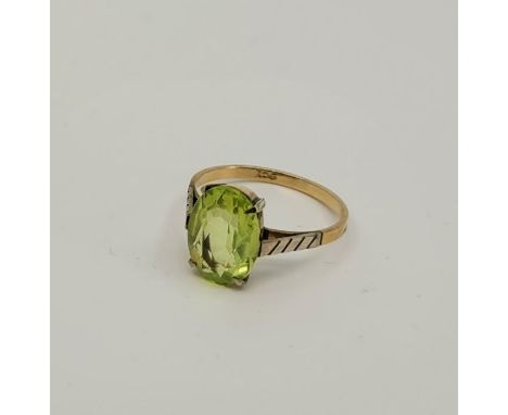 A 9ct. gold and light green paste set ring, size UK K 1/2+. (gross weight 1.75g)
