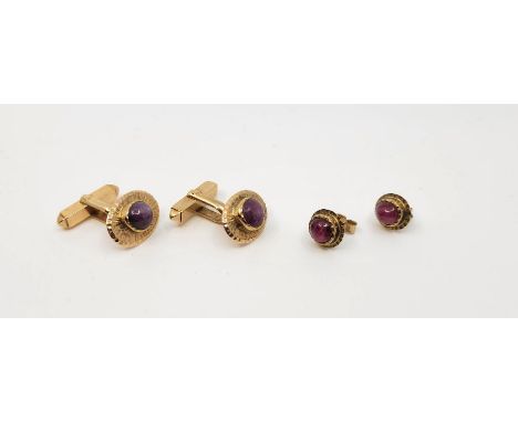 A pair of 10ct. gold and cabochon purple stone set oval cufflinks, toggle back fitting (gross weight 8.9g), together with a p