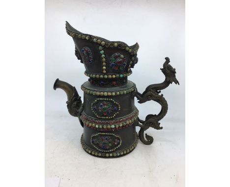 A Sino-Tibetan bronze ewer, embellished with jewel decoration with dragon handle. H:23cm