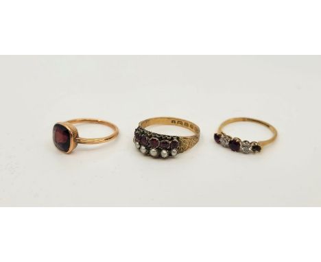 A 12ct. gold, ruby and pearl ring, set row of six graduated mixed cushion cut rubies and row of six graduated pearls, with en