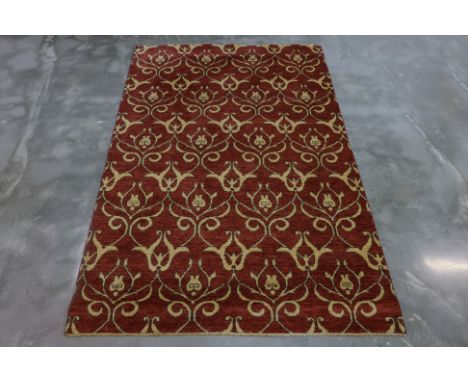 A CONTEMPORARY FOLIATE WOOL RUG (244 x 150cm)
Hand knotted wool pile, allover foliate design on a red ground
Ownership Statem
