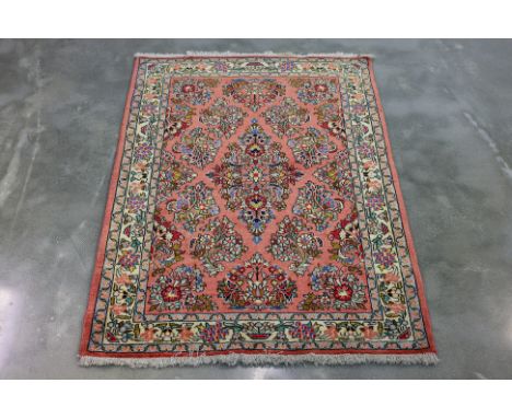 A PERSIAN FERAHAN WOOL RUG (156 x 110cm)
Hand knotted wool, coral field with all over floral motifs
Ownership Statement: This
