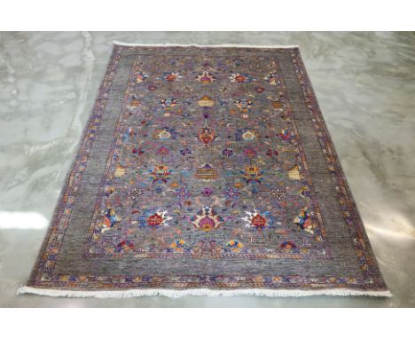 A ZOLLANVARI WOOL CARPET (280 x 230cm)
Hand knotted wool pile with a grey field, intricate multicolored floral and vine motif