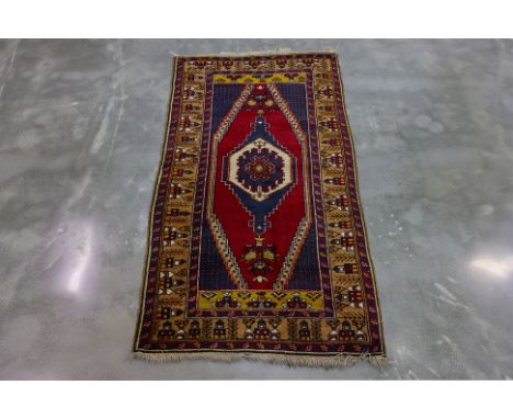 A VINTAGE TURKISH TRIBAL WOOL RUG (183 x 97cm)
Hand knotted wool
Ownership Statement: This item is offered for sale without d
