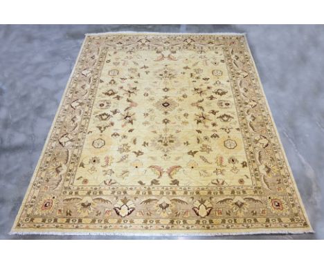 A LARGE MASOOMI WOOL CARPET (350 x 270cm)
Hand knotted wool pile with a soft cream field, delicate floral motifs and vine wor