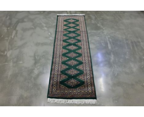 A KASHMIRI SAROUK WOOL RUNNER (242 x 75cm)
Hand knotted wool, repeating zigzag motifs
Ownership Statement: This item is offer
