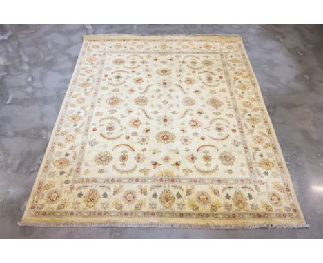 AN AFGHAN ZIEGLER WOOL RUG (249 x 199cm)
Hand knotted wool, cream field with flowers and scrolling foliage
Ownership Statemen