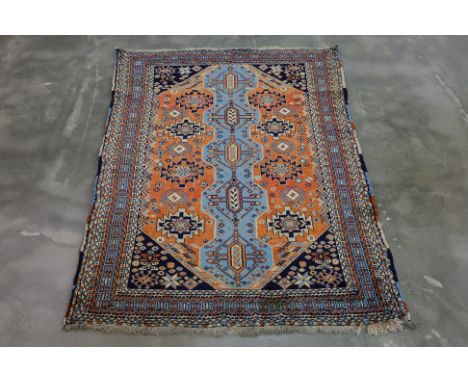 A KAZAK WOOL RUG (165 x 124cm)
Hand knotted wool pile, geometric designs on a pale orange field
Ownership Statement: This ite