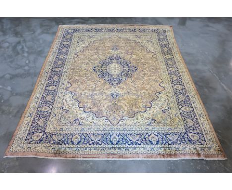 A KASHMIRI SILK AND WOOL CARPET (310 x 250cm)
Hand knotted silk and wool pile with a central medallion design in deep blue, s