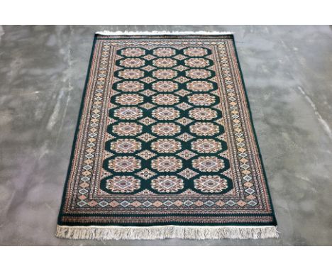 A KASHMIR WOOL AND SILK RUG (185 x 127cm)
Hand knotted wool and silk pile, three rows of guls on a green field
Ownership Stat